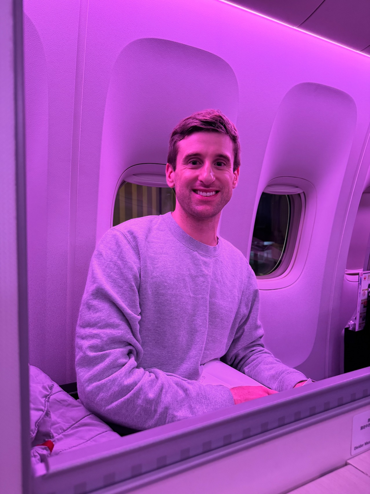 Nick in premium airplane cabin